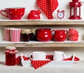 A rustic style. Ceramic tableware and kitchenware in red on the Royalty Free Stock Photo