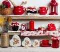 A rustic style. Ceramic tableware and kitchenware in red on the Royalty Free Stock Photo