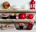A rustic style. Ceramic tableware and kitchenware in red on the Royalty Free Stock Photo