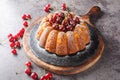 Rustic style cherry cake decorated with fresh berries and powdered sugar close-up on a wooden board. Horizontal Royalty Free Stock Photo