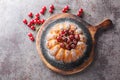 Rustic style cherry cake decorated with fresh berries and powdered sugar close-up on a wooden board. Horizontal top view Royalty Free Stock Photo