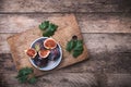 Rustic style Cut figs in flat dish on choppingboard Royalty Free Stock Photo