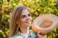 Rustic style. Romantic daydreamer hold summer hat. Rustic soul. Straw hat adorable girl. Rustic outfit. Ranch culture Royalty Free Stock Photo