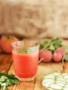 Rustic style. Tomato juice on the wooden table.