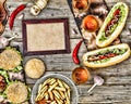 Hot dogs and beer on a wooden table. Rustic style, top view homemade burgers with beef Royalty Free Stock Photo