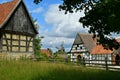 Rustic summer landscape. Beautiful village photo, old houses, green grass, blue sky. Royalty Free Stock Photo