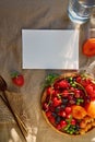 Rustic summer seasonal stationery card mock up with hard shadows, sunlight and fresh fruits and berries. Top view Royalty Free Stock Photo