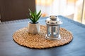 Rustic Table Decor Featuring Aloe Vera Plant in Pot and Star-Patterned Candle Holder Royalty Free Stock Photo