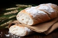 Rustic table setting with freshly baked bread and sheaves of wheat, vintage country decoration