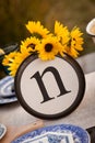 Rustic table setting with lettered plate. Royalty Free Stock Photo