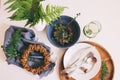 rustic table setting in natural forest style with wild ferns, wooden details and soft woodland tones. Royalty Free Stock Photo