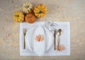 Rustic table setting on wooden table: gold vintage silverware, linen napkin and olive brunch. Romantic or wedding concept Royalty Free Stock Photo