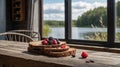 Rustic Breakfast with Berries and Bread by the Lake Window in Soft Morning Light. Royalty Free Stock Photo