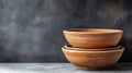 Rustic terracotta bowls stacked dark background Royalty Free Stock Photo