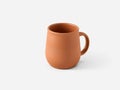 Rustic terracotta mug on a clean white background Royalty Free Stock Photo