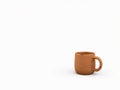 Rustic terracotta mug on a clean white background Royalty Free Stock Photo