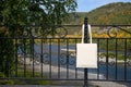 Rustic tote bag on the metal park fence mockup