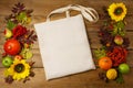 Rustic tote bag mockup with sunflowers and rowanberry