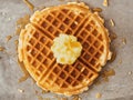 Rustic traditional waffle with butter and maple syrup