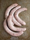 Rustic uncooked italian pork sausage Royalty Free Stock Photo