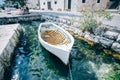 Rustic vintage antique boat docked in old bay