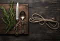 Rustic vintage set of cutlery knife, spoon, fork. Black background. Top view. Created with Generative AI technology. Royalty Free Stock Photo