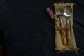 Rustic vintage set of wooden spoon and fork on black background Royalty Free Stock Photo