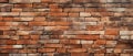 A rustic wall of damaged bricks in shades of orange, brown, and red, exemplifying aged brickwork and stonework, Ai Generated