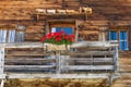 Rustic wall and window in a alpine hut Royalty Free Stock Photo