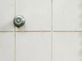 Rustic water shower knob on old wall