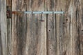 Rustic weathered barn wood with a piece of metal and nails Royalty Free Stock Photo