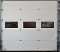 Rustic, Weathered Door of a Cracked, Broken Garage