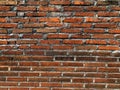 Rustic weathered orange and red brickwork surface Royalty Free Stock Photo
