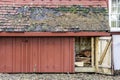 Rustic weathered wood storage shed with open door, roof shingles Royalty Free Stock Photo