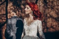 Rustic wedding couple relaxing and posing in sunlight at background of wooden wall in country. barn wedding concept, space for Royalty Free Stock Photo