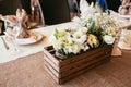 Rustic wedding decorations. wooden box with bouquet of flowers o Royalty Free Stock Photo