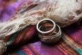 rustic wedding rings in an abalone shell, on a lace tablecloth Royalty Free Stock Photo