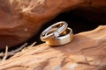 rustic wedding rings on a sandstone rock in a desert setting Royalty Free Stock Photo