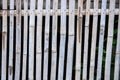 Rustic white bamboo fence. Think wooden plank handmade wall. Transparent wooden fence in rustic countryside style Royalty Free Stock Photo