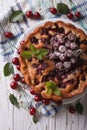 Rustic whole cherry pie close up vertical top view Royalty Free Stock Photo