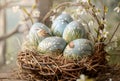 A rustic wicker basket contains beautifully hand-painted Easter eggs, each decorated with delicate spring scenes of blooming Royalty Free Stock Photo