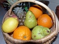 Rustic wicker basket with fresh fruit. Closeup. Natural product