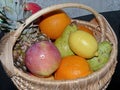 Rustic wicker basket with fresh fruit. Closeup. Natural product