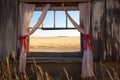 a rustic windmill in a prairie through a ribbon window