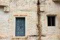 A rustic window and a door at an ashram complex in Hampi