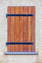 Rustic window in wooden strips. Wood and iron on concrete wall