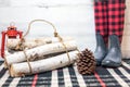 Rustic winter background with boots, logs and pinecone Royalty Free Stock Photo