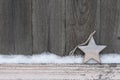 Rustic Winter Background With Wooden Christmas Star And Snow On Wooden Texture. Christmas And New Year Greeting Card