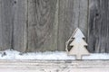 Rustic winter background with Christmas tree and snow on wooden texture. Christmas and New Year greeting card background Royalty Free Stock Photo
