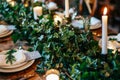 Rustic winter wedding table setting with ivy centrepiece Royalty Free Stock Photo